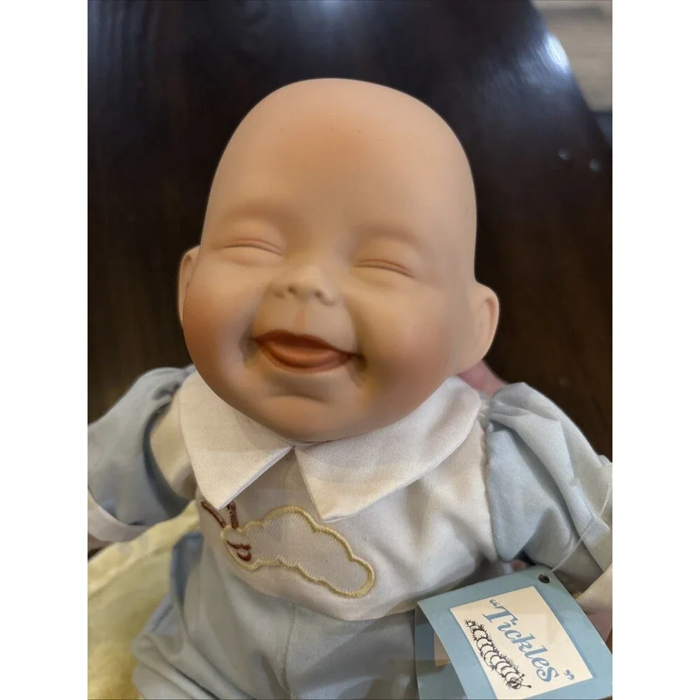 Ashton Drake tickles porcelain